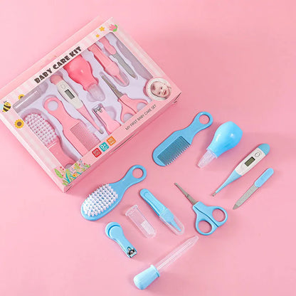 Contents of baby essentials kit: nasal aspirator, finger toothbrush, and ear cleaner