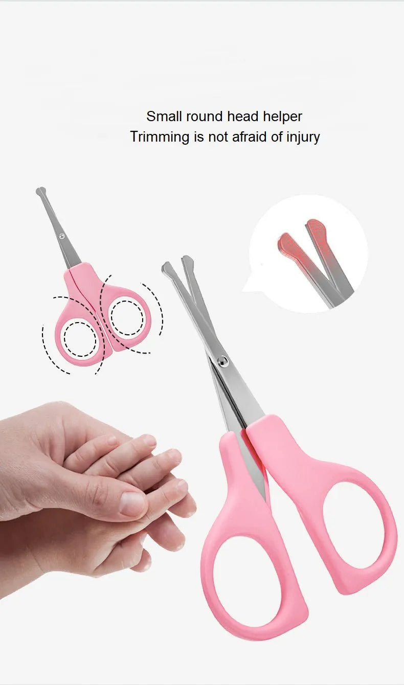 Detailed shot of baby nail clippers and a soft brush from the infant essentials kit