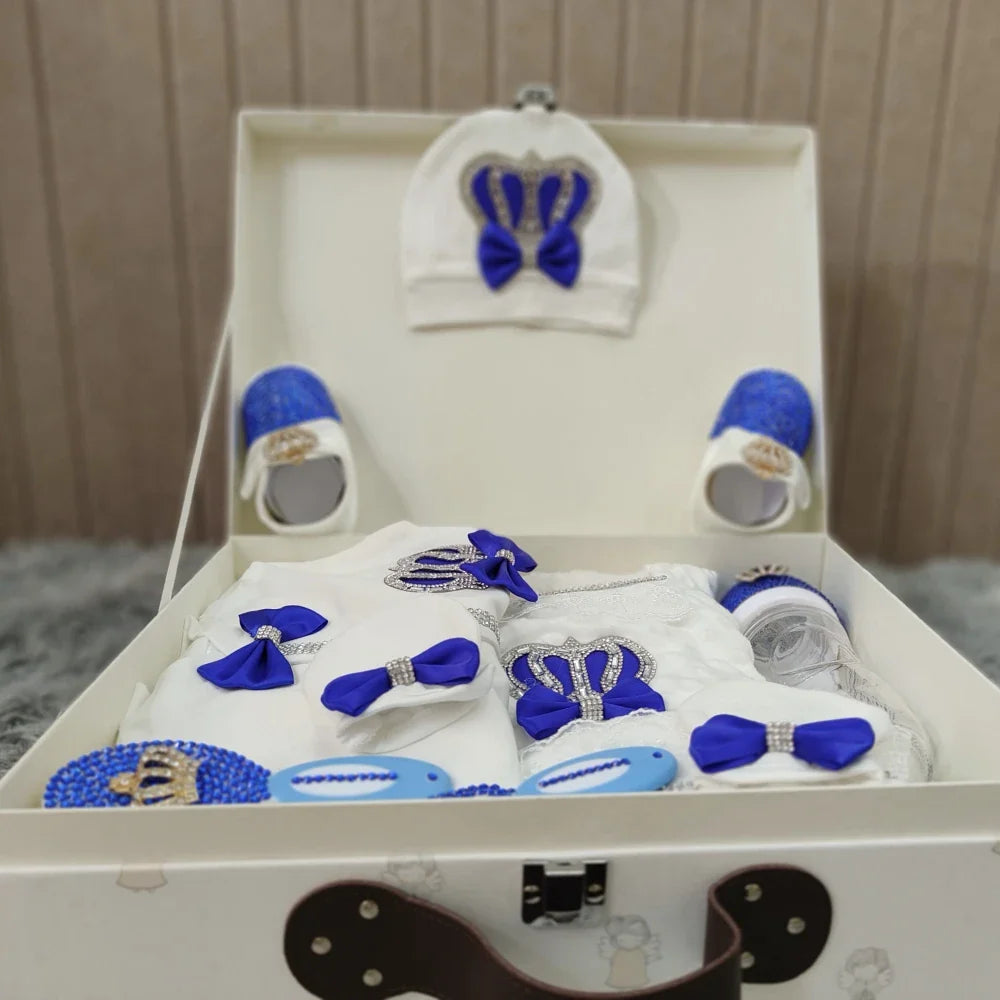 Collection of newborn baby accessories: hat, scratch mittens, and booties from a 10-piece welcome home baby gift set