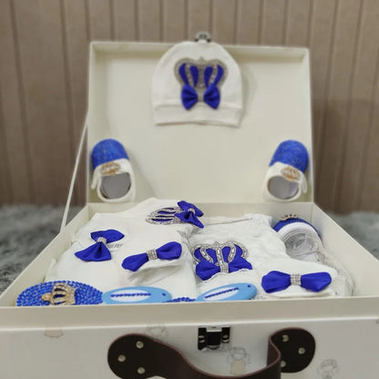 Collection of newborn baby accessories: hat, scratch mittens, and booties from a 10-piece welcome home baby gift set