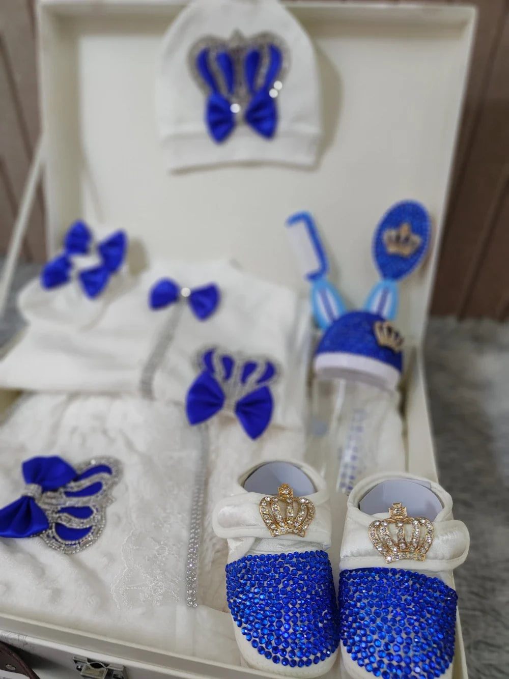 Beautifully packaged 10-piece baby gift set in blue, featuring baby clothing and newborn essentials for a baby boy