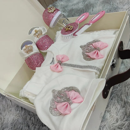 Pink 10-piece baby clothes gift set, including two soft blankets and luxury cotton infant wear, perfect for a coming home outfit