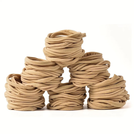100 PCS soft nylon headbands for unisex babies, perfect newborn and infant hair accessories.
