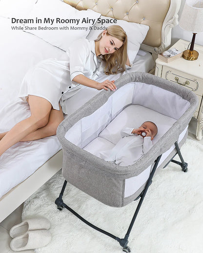 Foldable baby crib with rocking function and silent wheels, ideal for nursery & travel.