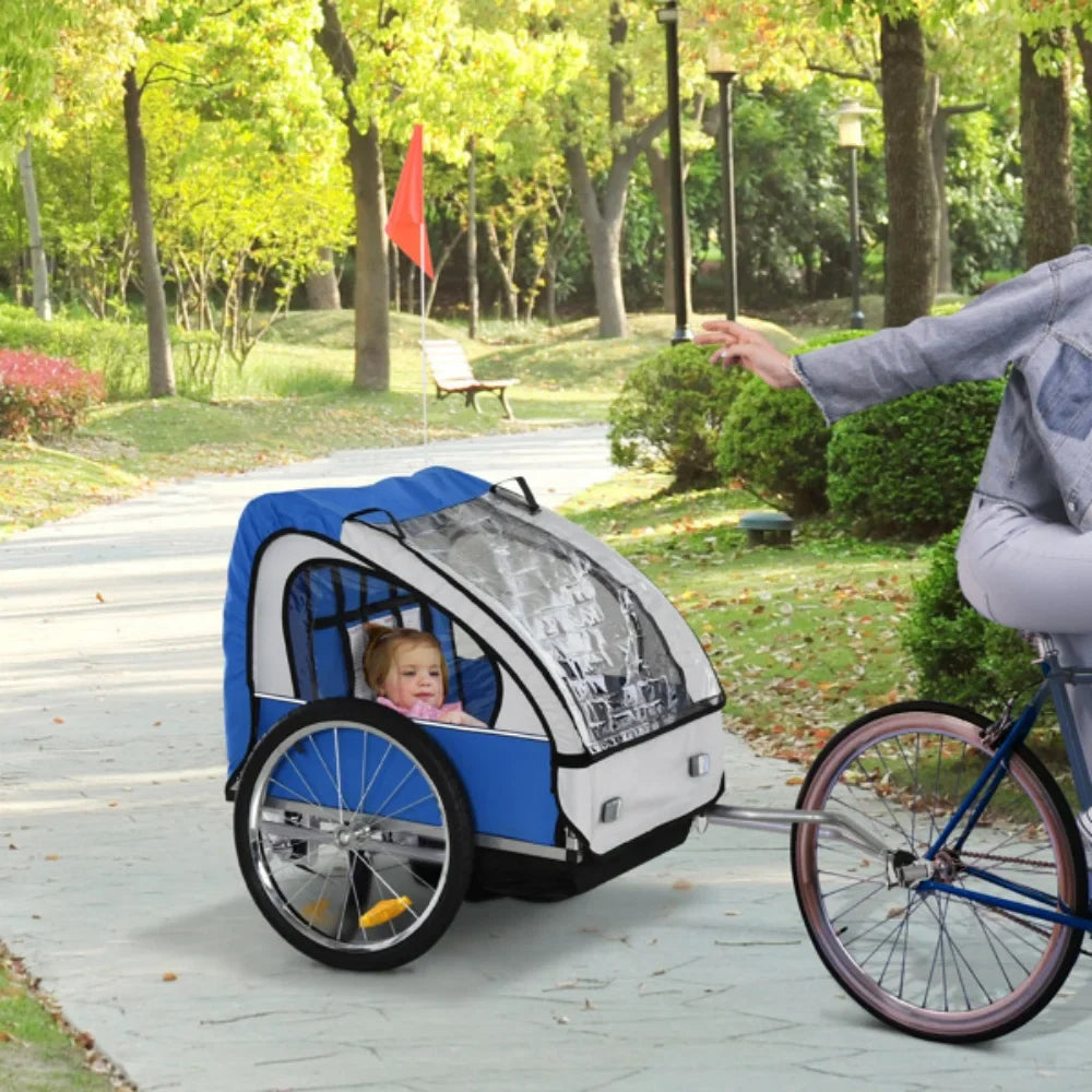 2-in-1 foldable bike trailer for kids & pets with safety harness, attached to a bicycle for family cycling