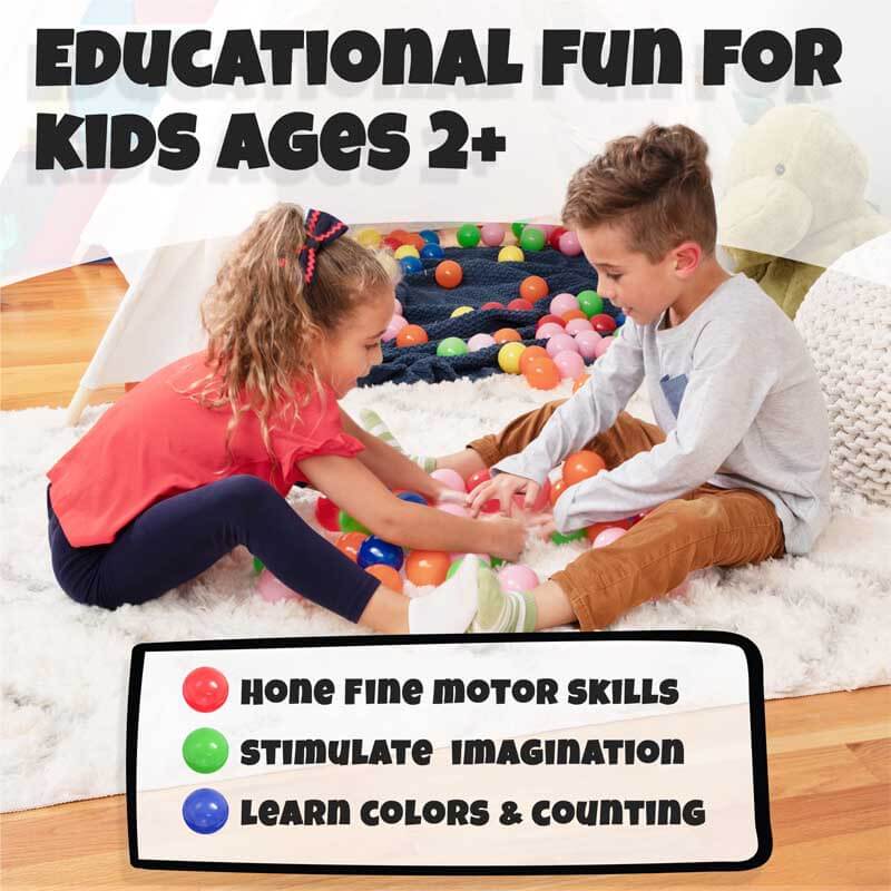 Happy child surrounded by 200 safe, crush-proof pit balls in a home ball pit, joyful playtime.