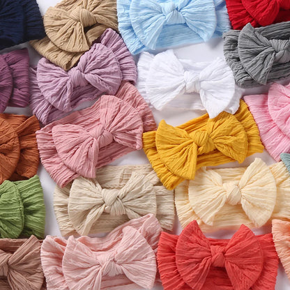 Detail shot of the stretchy fabric on a baby headband, ensures comfortable fit