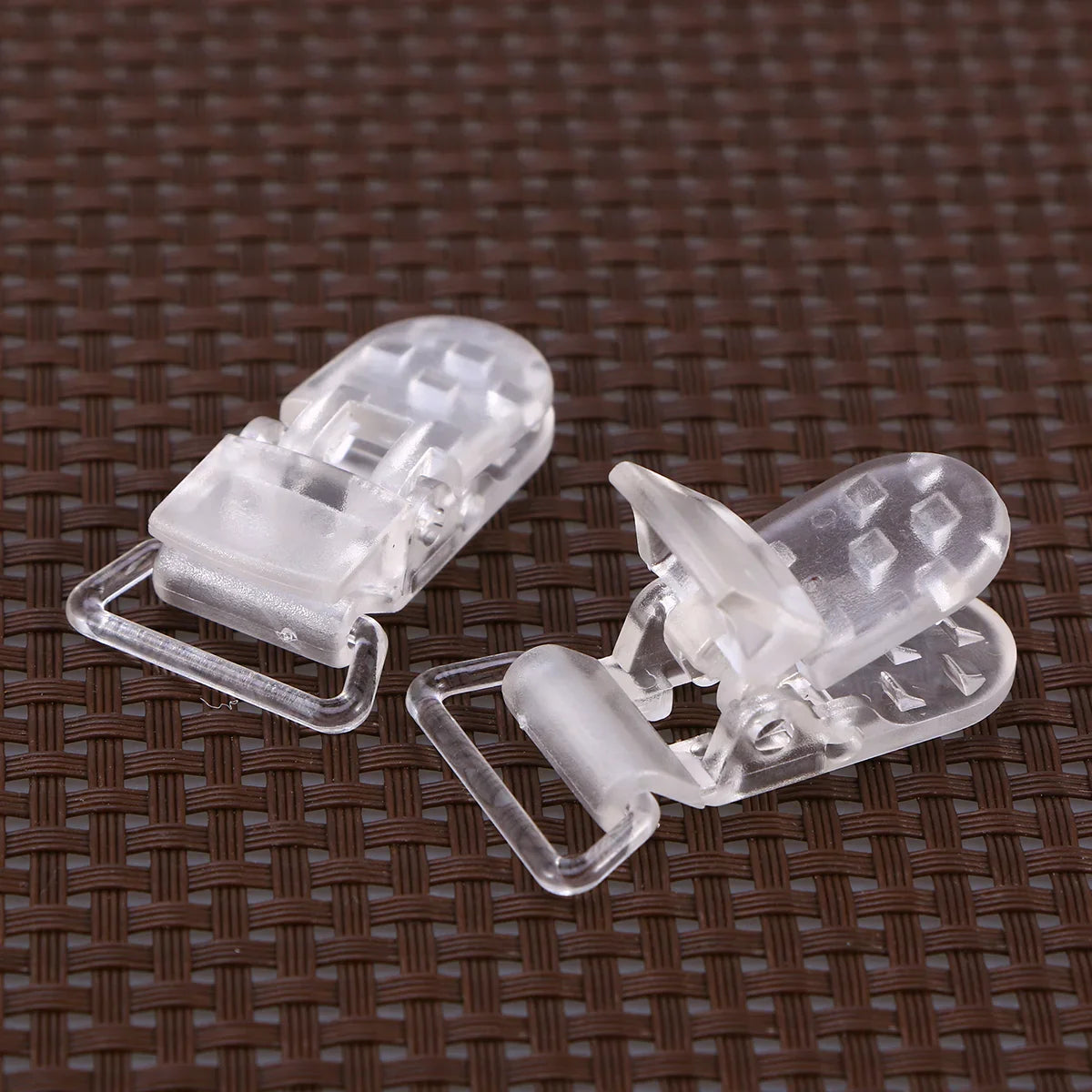 Versatile clear plastic T-clips, great for pacifier leashes, bibs, and toy attachments