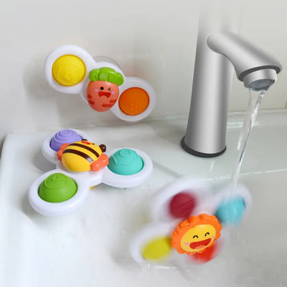 Yellow spinning top, a developmental baby toy with strong suction cups for easy attachment