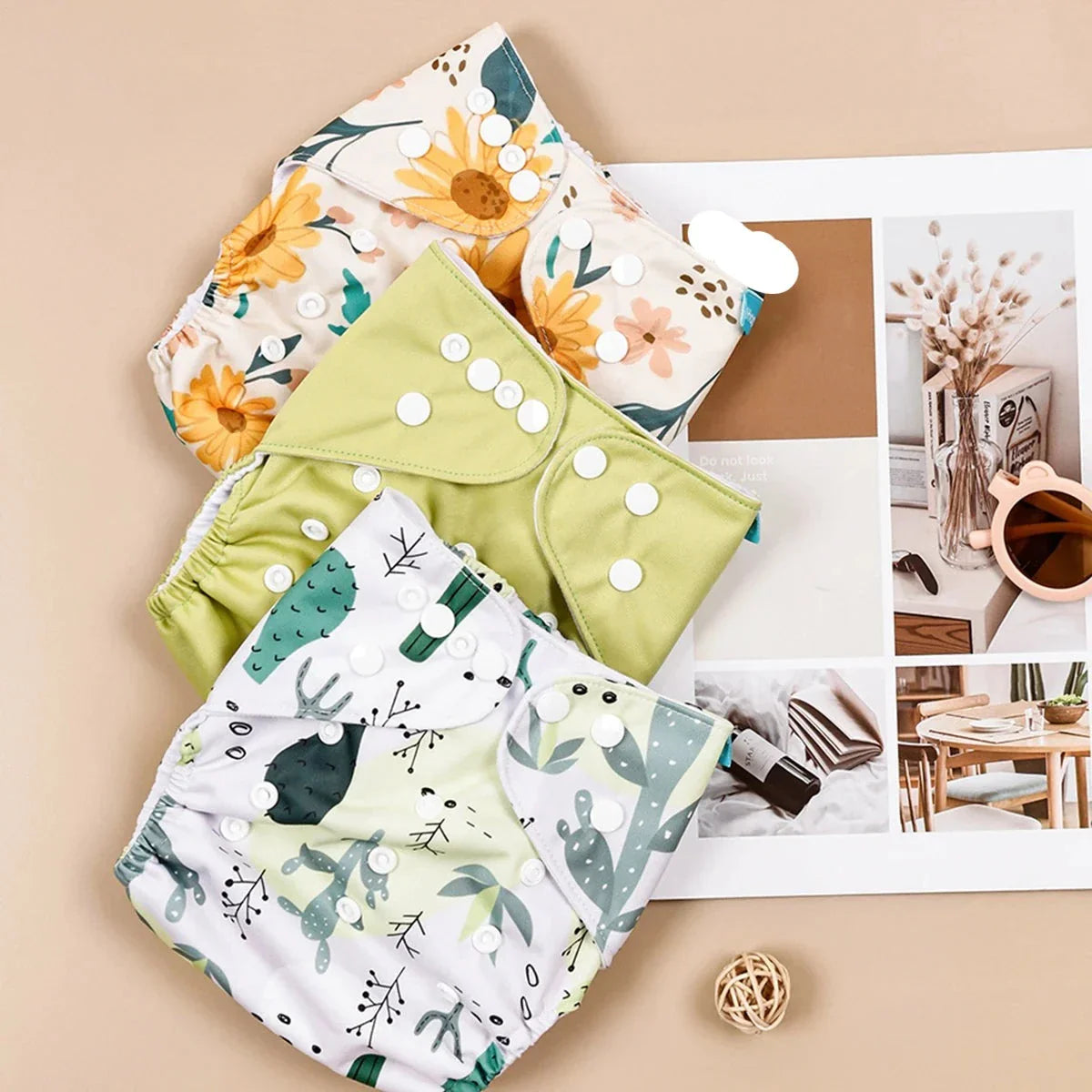 Infant comfort with 3 reusable cloth diapers, eco-friendly and unisex, a smart choice for baby care.