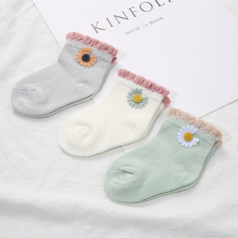 A trio of comfortable cotton baby socks, ideal for infant clothing and everyday wear.