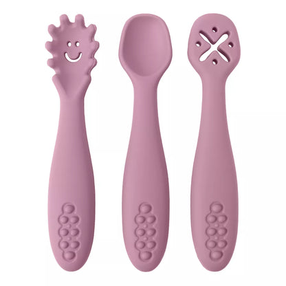 Set of three colorful silicone self-feeding utensils for infants learning to eat