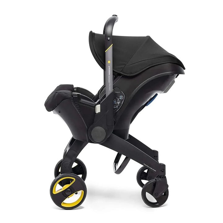 Toddler sitting comfortably in the reversible basket of the 4-in-1 baby stroller travel system.