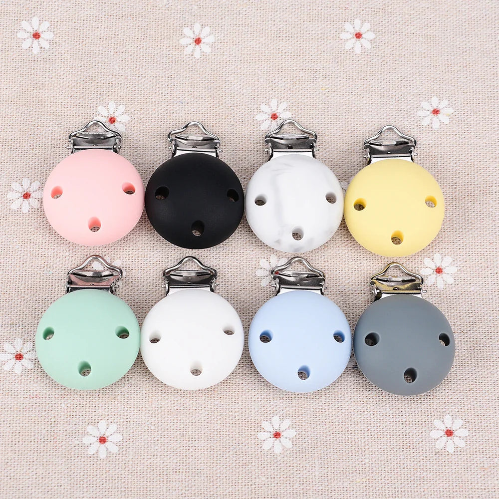 Gift-ready 5-pack of round silicone pacifier clips, BPA-free, perfect for new parents.
