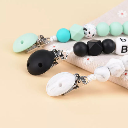 High-quality 5-pack silicone round pacifier clips, BPA-free, a must-have for baby feeding.