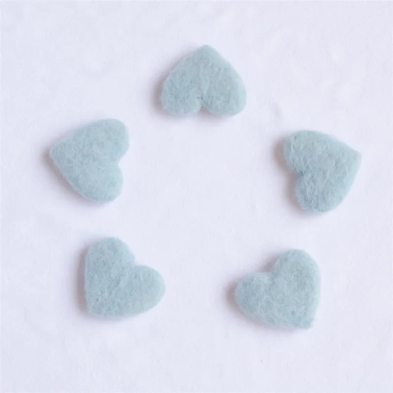 Infant photoshoot accessories: a selection of small wool love hearts, handmade for newborns