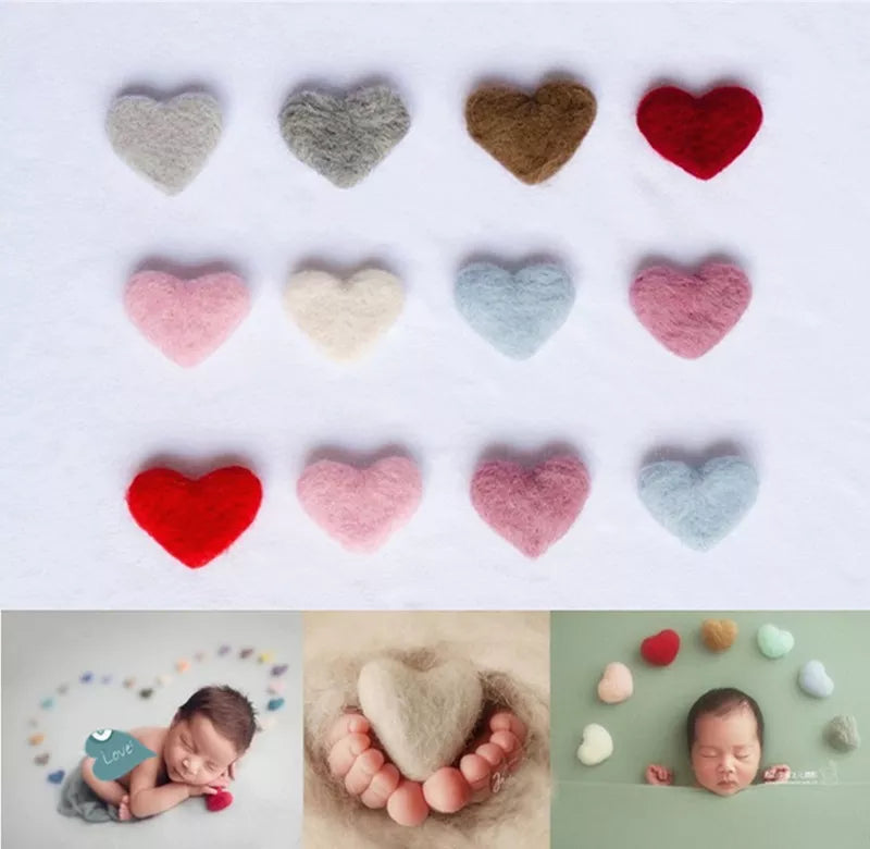 Close-up of soft pink wool love heart photography prop for newborn baby photoshoots