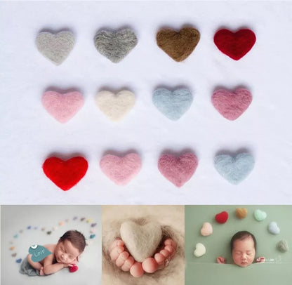Close-up of soft pink wool love heart photography prop for newborn baby photoshoots