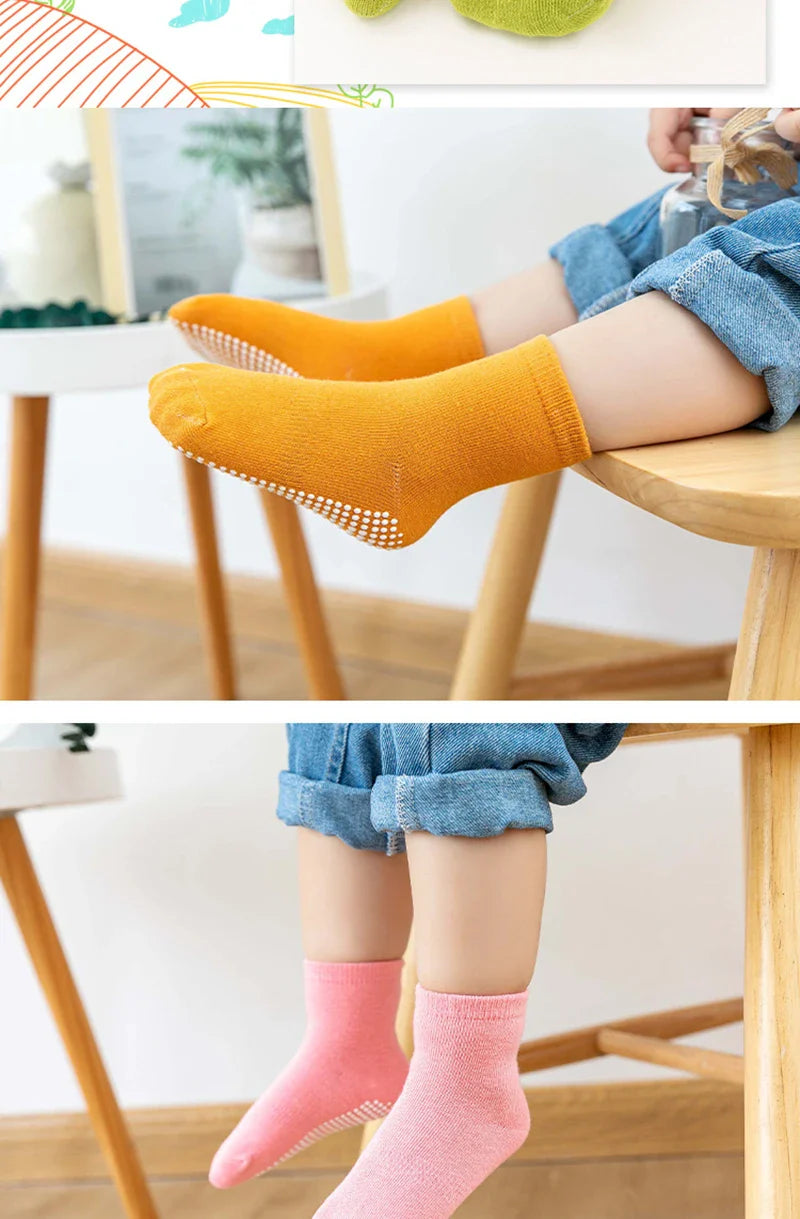 Happy child jumping in anti-slip cotton socks, showcasing freedom of movement for spring play