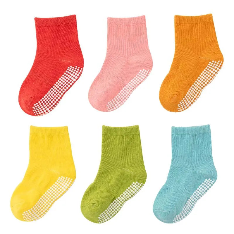 Detail view of the soft cotton fabric and anti-slip sole of kids socks, toddler playwear