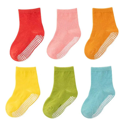 Detail view of the soft cotton fabric and anti-slip sole of kids socks, toddler playwear