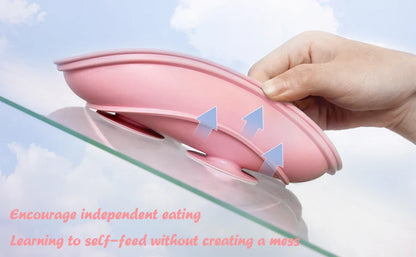 Stylish silicone tableware for toddlers in calming green, with suction plate, bowl, cup, and matching cutlery.