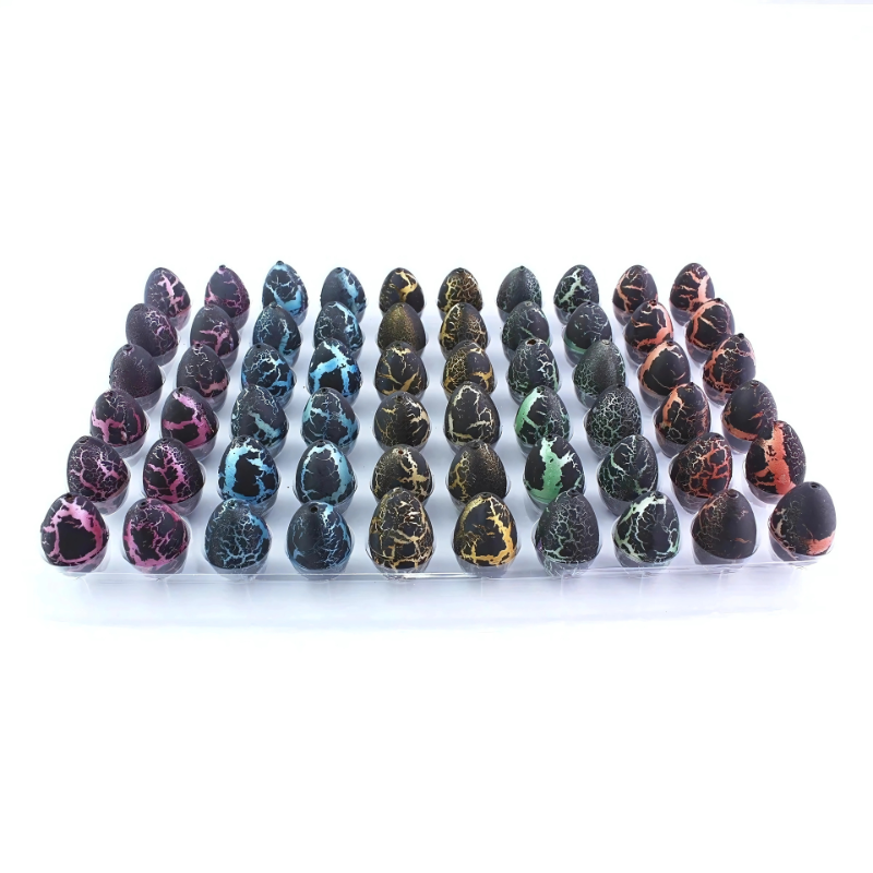 Close-up of a child's hand holding a magical hatching dinosaur egg, educational kids' toy