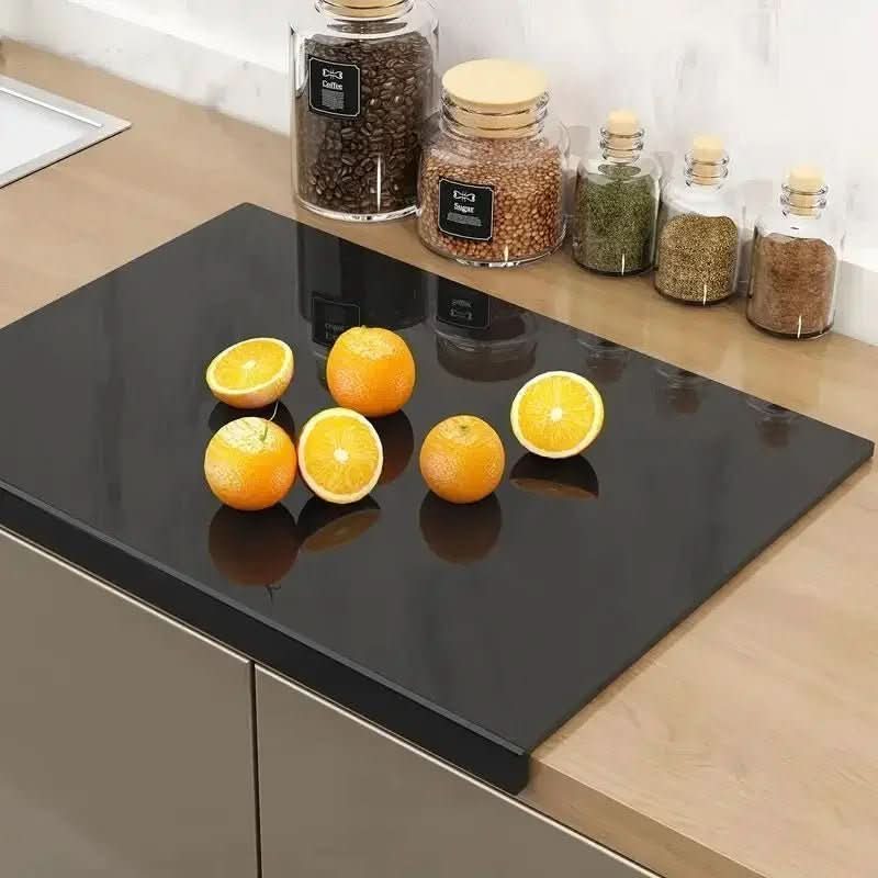 Acrylic cutting board with protective lip, ideal for kitchen food prep & countertop protection.