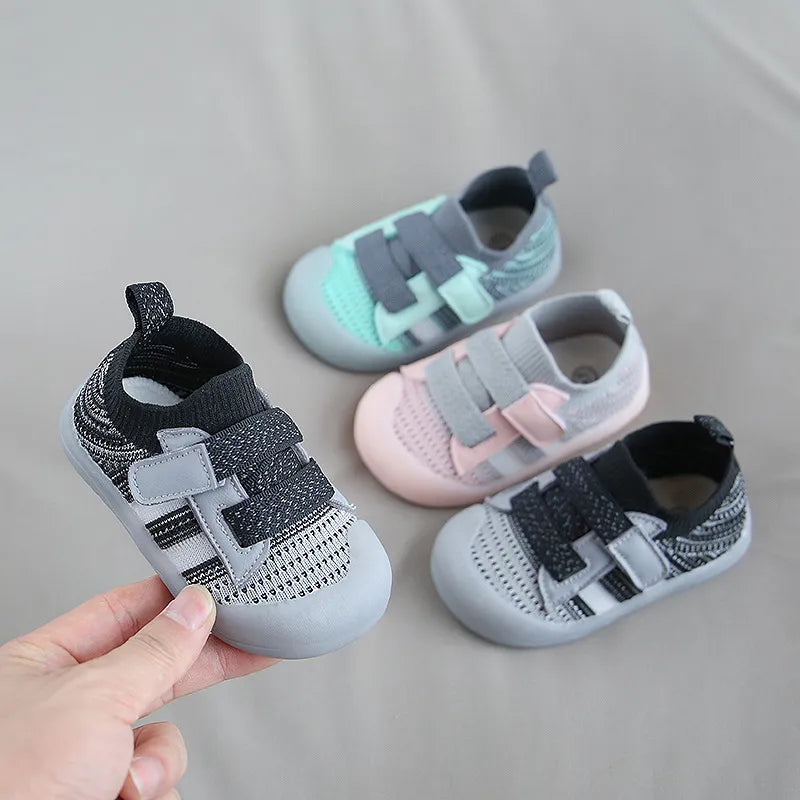 Side view of kids' breathable sneakers, showing soft sole and mesh fabric