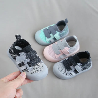 Side view of kids' breathable sneakers, showing soft sole and mesh fabric