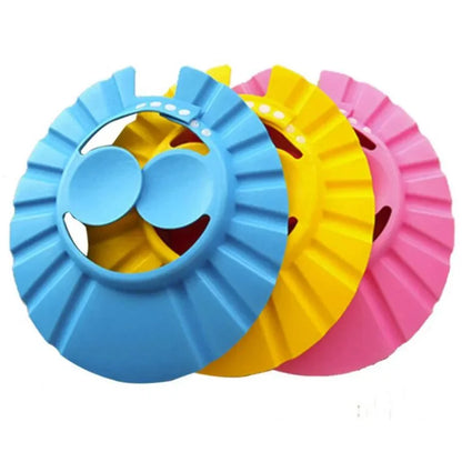 Adjustable baby shower cap in blue, protecting child's eyes & ears during bath time