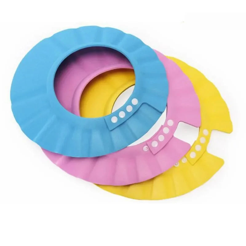 Toddler wearing a yellow EVA foam shower cap, eye & ear protection for stress-free bathing