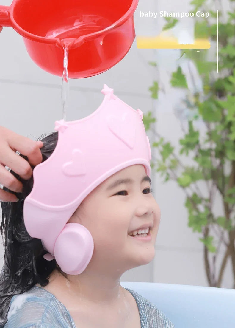 Adjustable orange baby shower cap, ear protection, anti-slip design for secure toddler bathing.