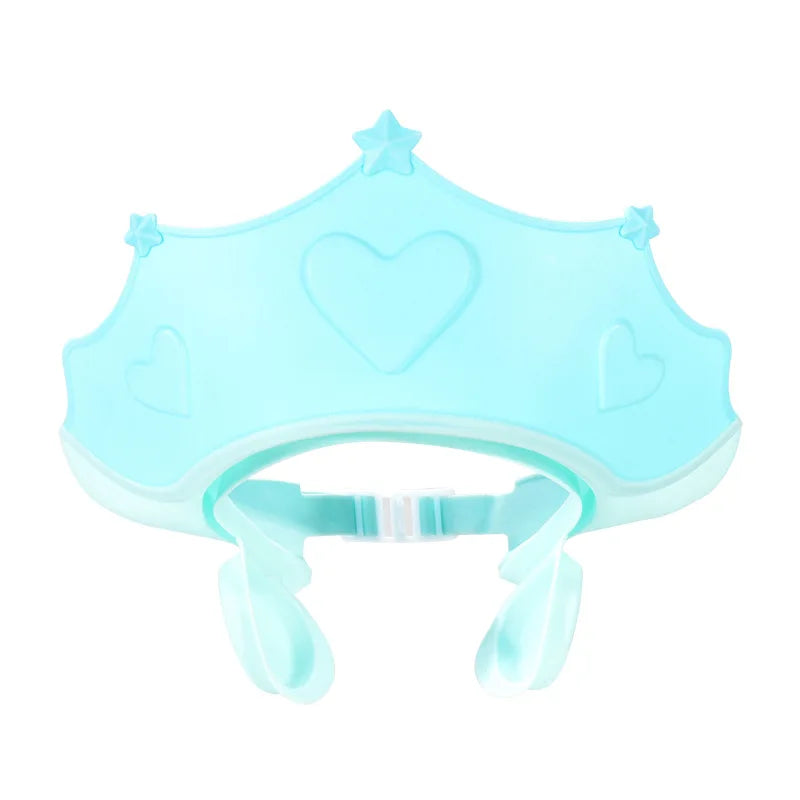 Blue baby hair wash cap with ear protection, adjustable strap ensures snug fit for kids.
