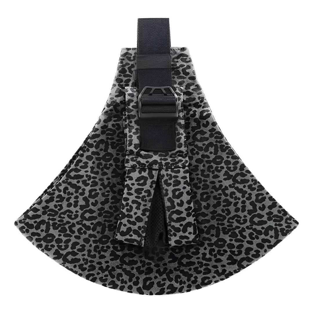 Happy baby sleeping soundly in a cozy, ergonomic baby carrier sling.