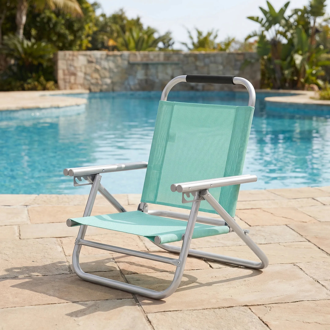 Adjustable folding beach chair, lightweight & portable for outdoor relaxation, camping, and travel.