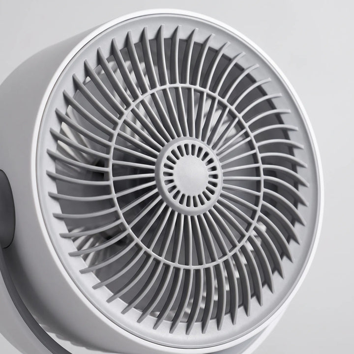 Compact & quiet adjustable pedestal fan with USB power & remote for comfortable, portable home cooling.