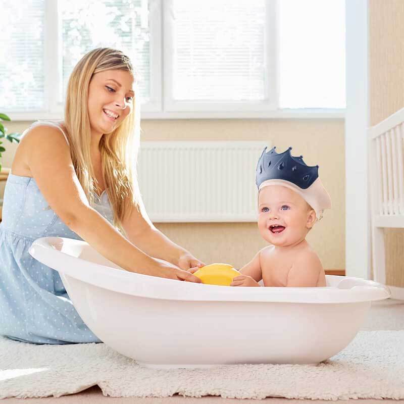 Unisex waterproof baby bath cap with secure fit for toddlers, safe eye and ear protection.
