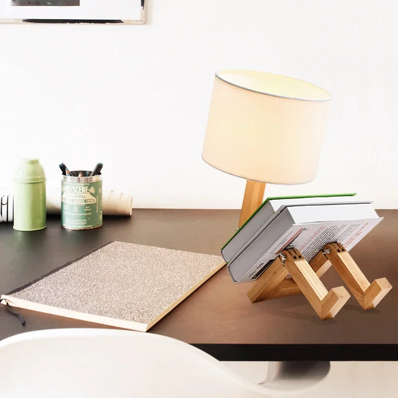 Stylish wooden robot lamp for tables, offering adjustable light and convenient storage.