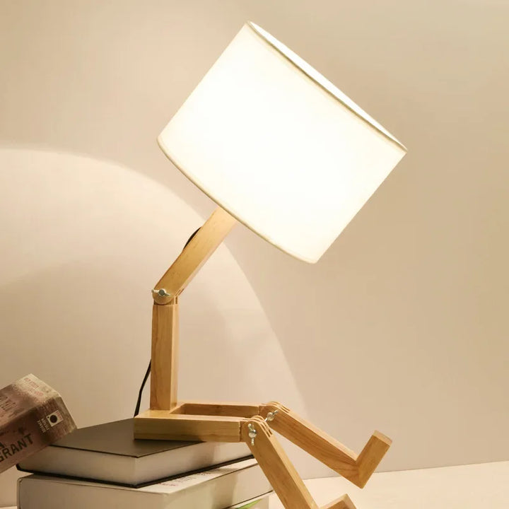 Ergonomic adjustable wooden desk lamp, a robot design with a built-in storage shelf.