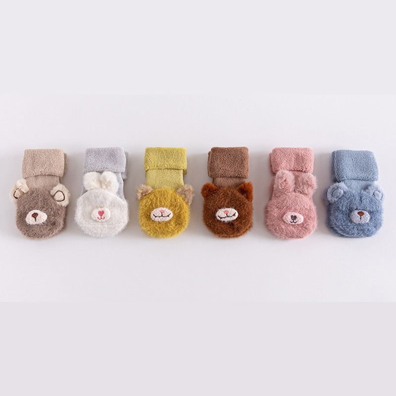 Durable anti-slip toddler socks with cute animal prints, designed for playful adventures.