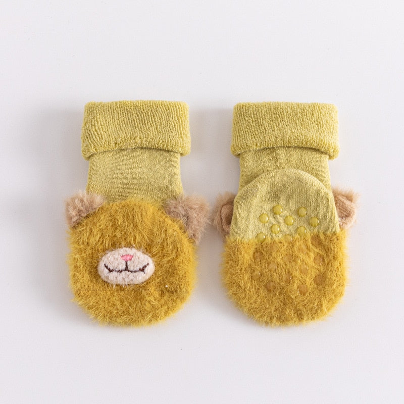Close-up of anti-slip toddler socks featuring a playful animal, ensuring secure footing for babies.