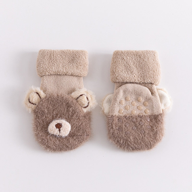 Stylish baby clothing accessory: anti-slip animal socks, providing warmth and grip for young children.