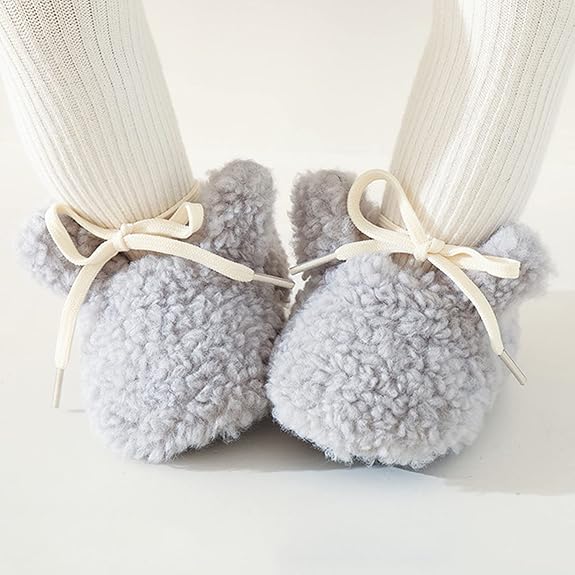 Non-slip baby animal slippers for infants, soft and cozy for indoor wear and developing steps.