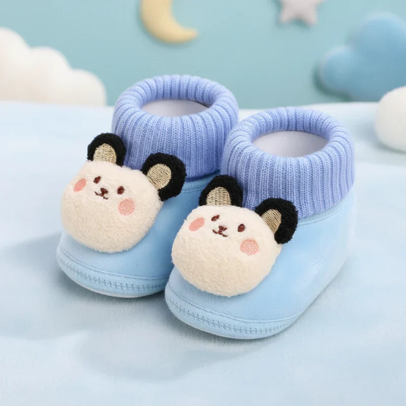 Charming animal print baby slippers, non-slip, designed for warm and secure first steps.