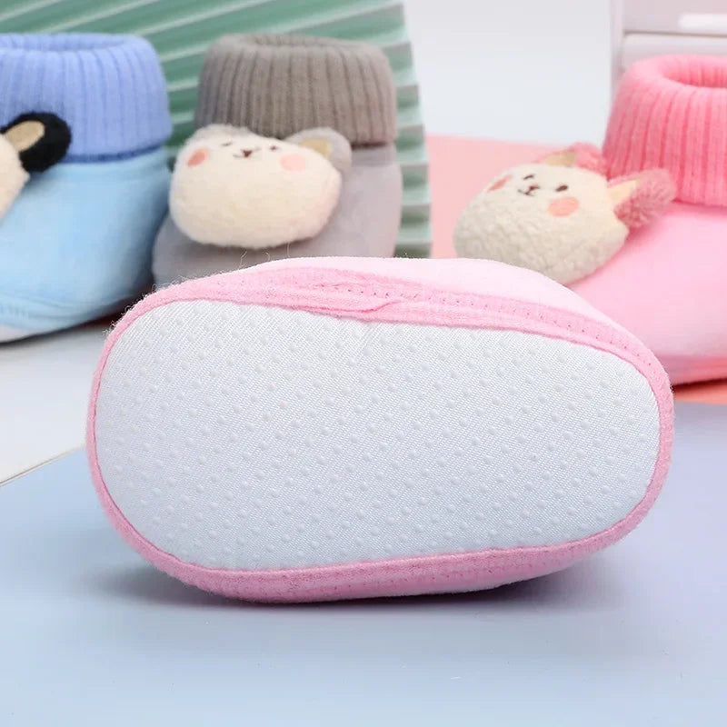 Infant footwear: warm animal-themed non-slip slippers, great for baby's first steps.