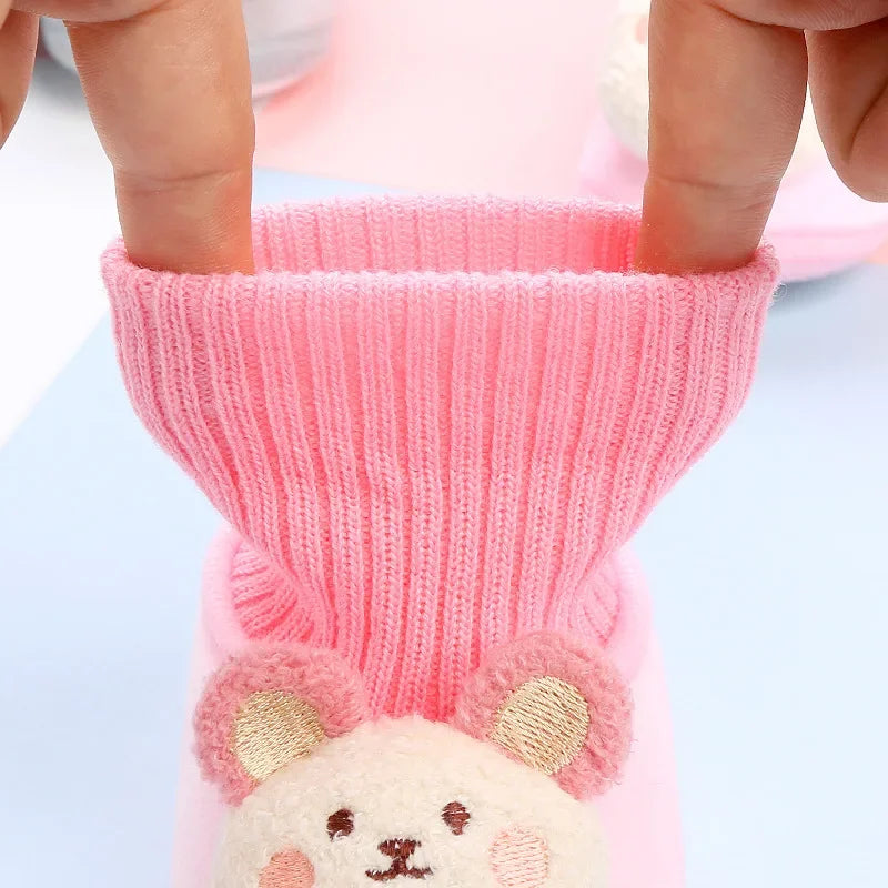 Cozy baby winter slippers with an animal design and non-slip grip for new walkers.
