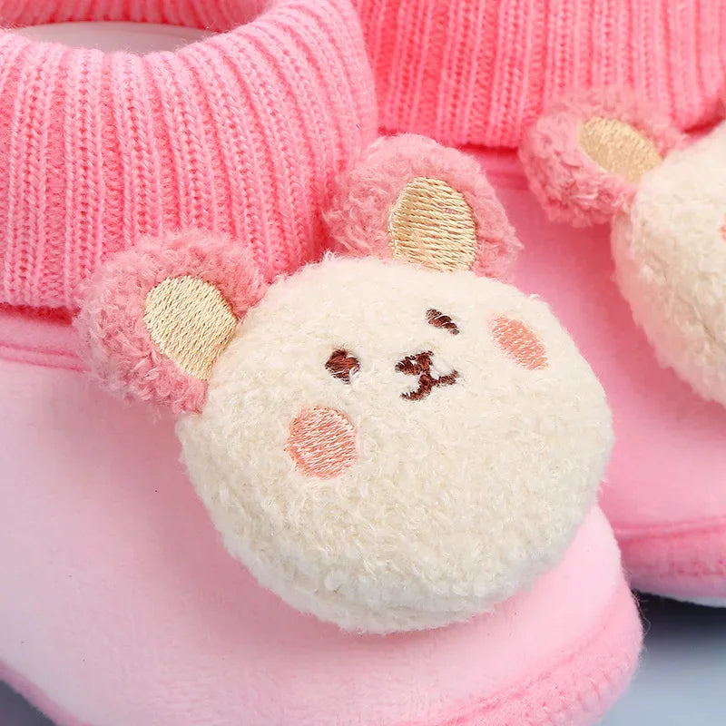 Plush non-slip baby winter shoes, animal print, ensuring warm and stable first steps.