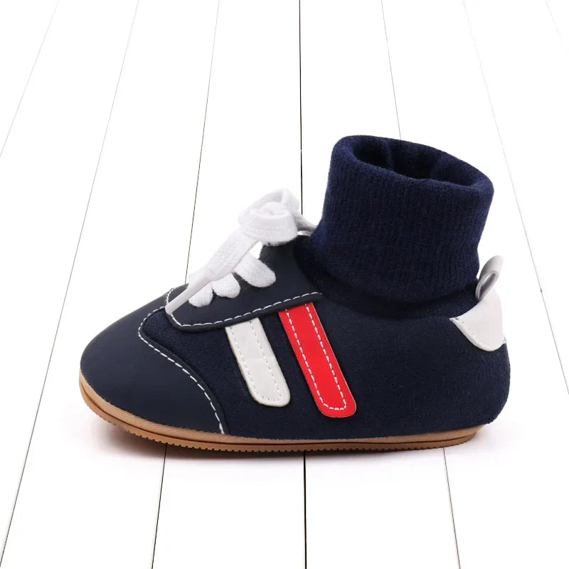 Close-up of soft sole infant crib shoes in cotton, an anti-slip design for baby's safety.