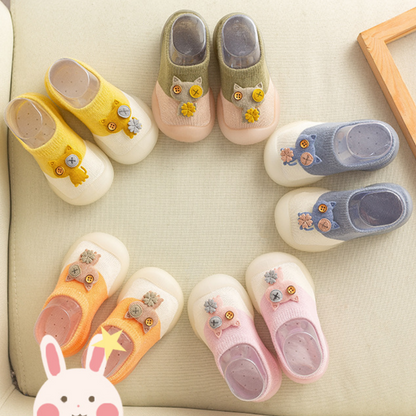 Adorable baby anti-slip walker shoes with cute cat design for infants taking their first steps, soft knitted.